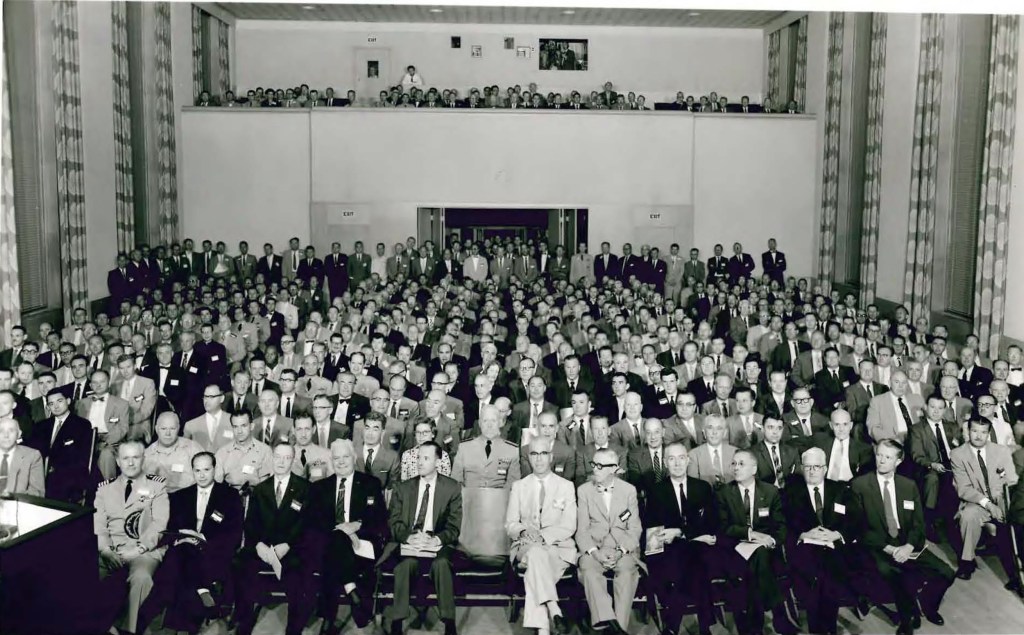 Group seated in auditorium.