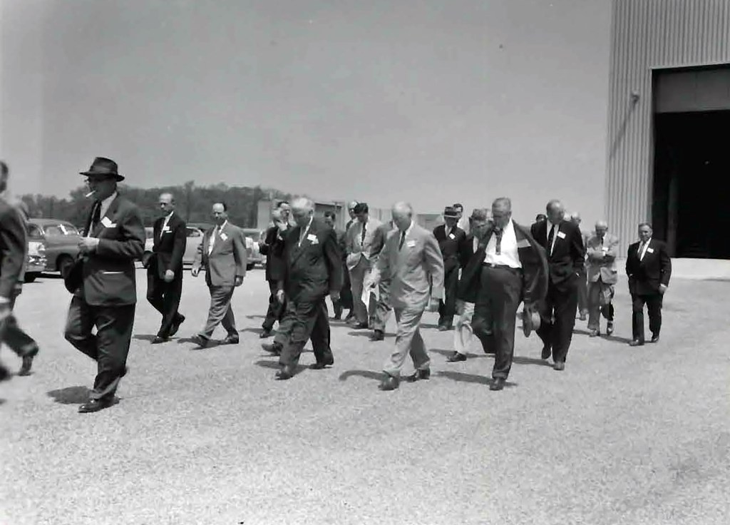 Group of men exiting building