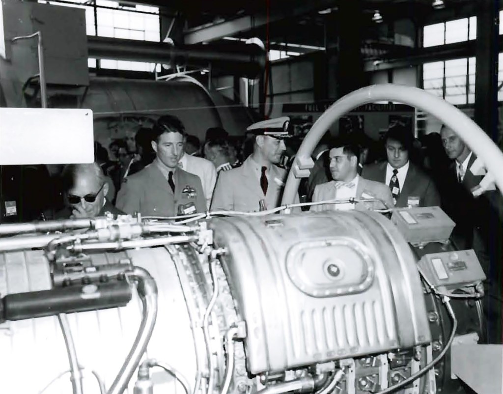 Men looking at engine.