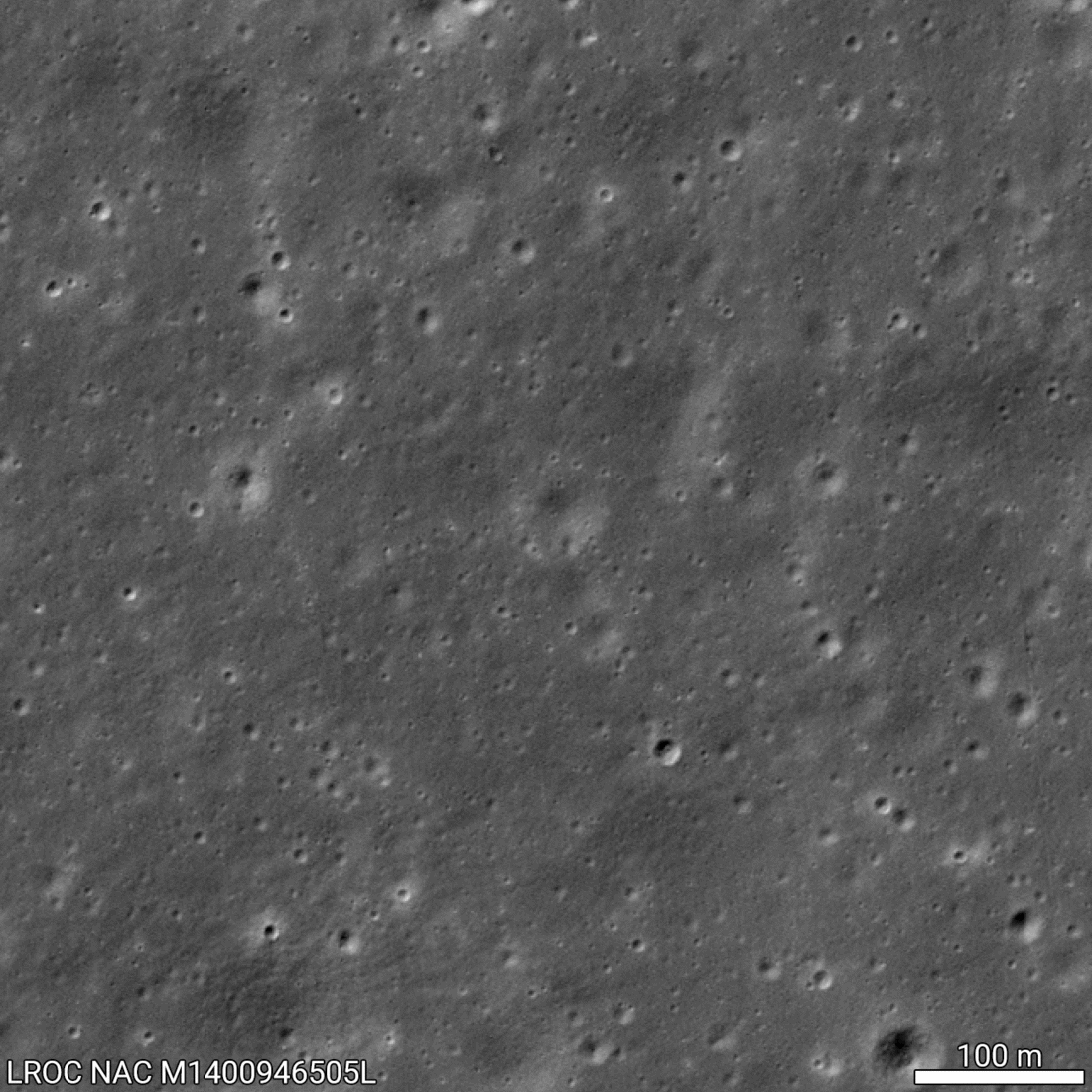 A black and white gif of two images of the Moon's surface before and after Chang'e 6 landed on the surface. A scale line for 100m is in the bottom right. The second image is slightly brighter around the landing site.