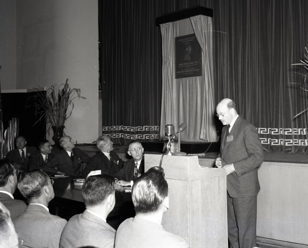 Man speaking at podium
