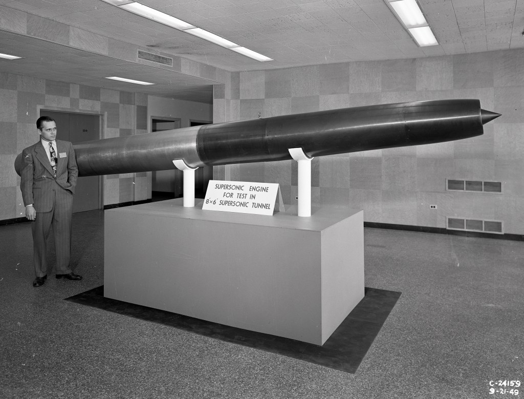 Man with missile model.