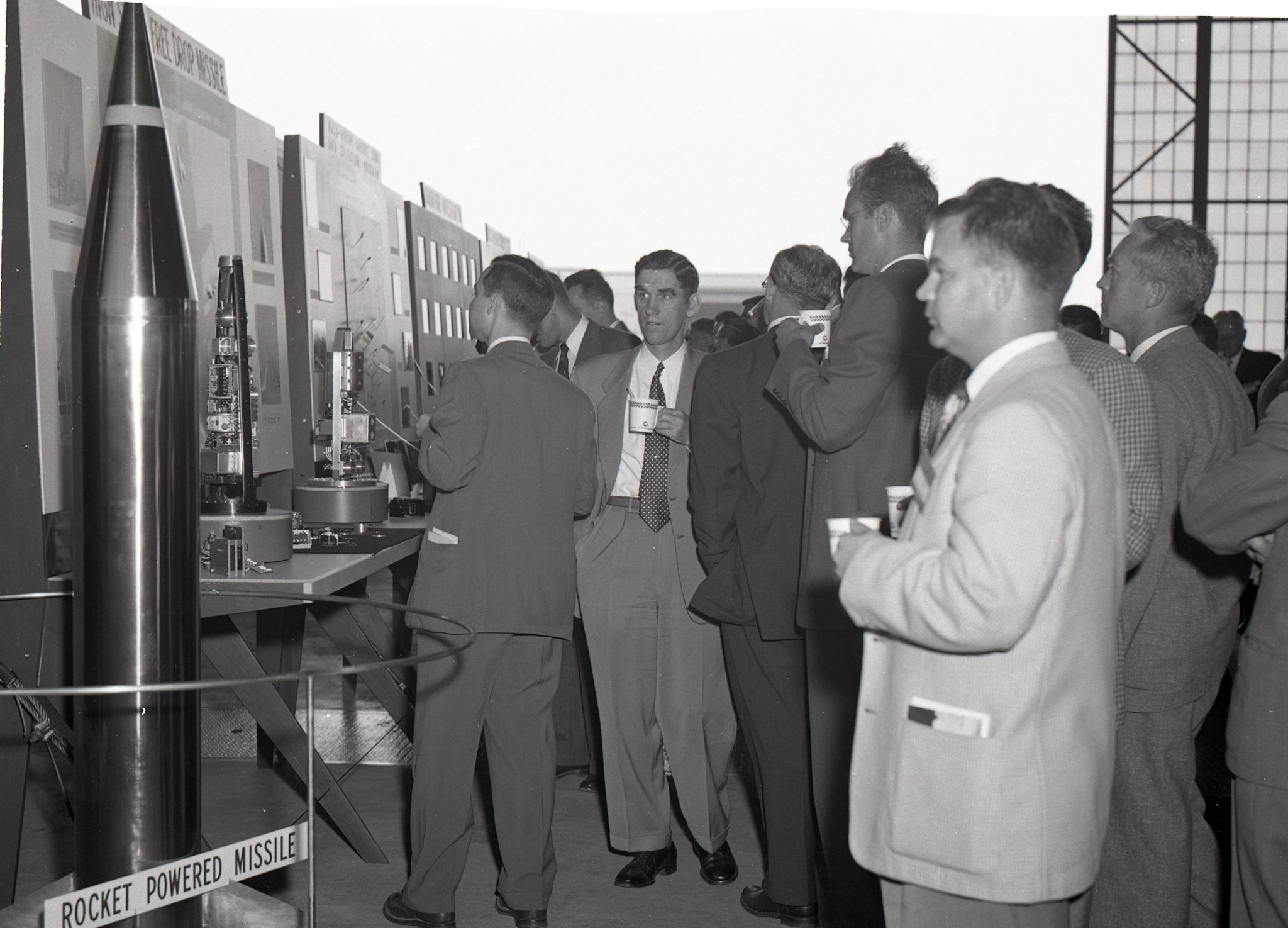 Men looking at displays.