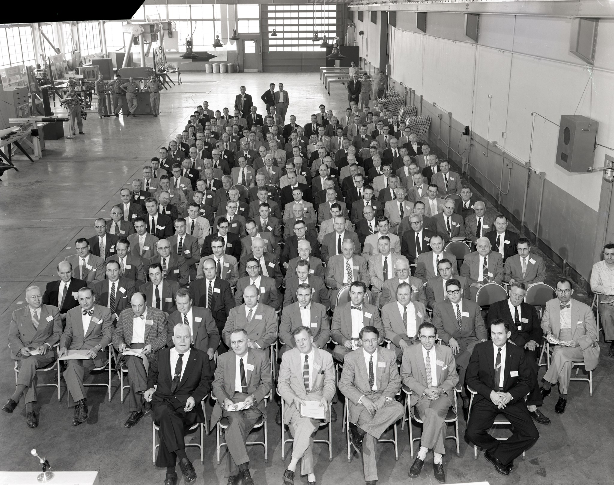 Group seated in shop area.