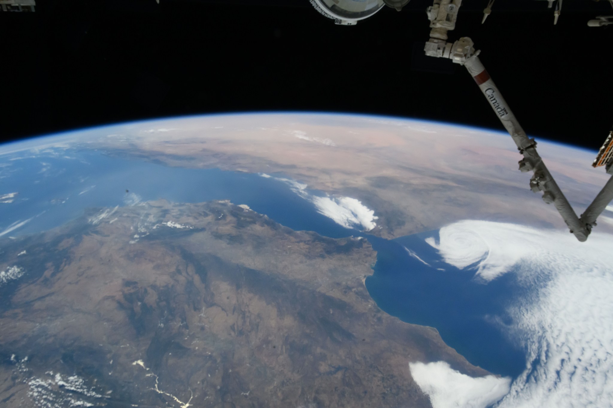 iss071e217183 (June 25, 2024) -- As the International Space Station orbited 263 miles above Earth, NASA astronaut Butch Wilmore captured this image of Spain and Morocco. The Strait of Gibraltar separates the two countries and connects the Atlantic Ocean to the Mediterranean Sea.