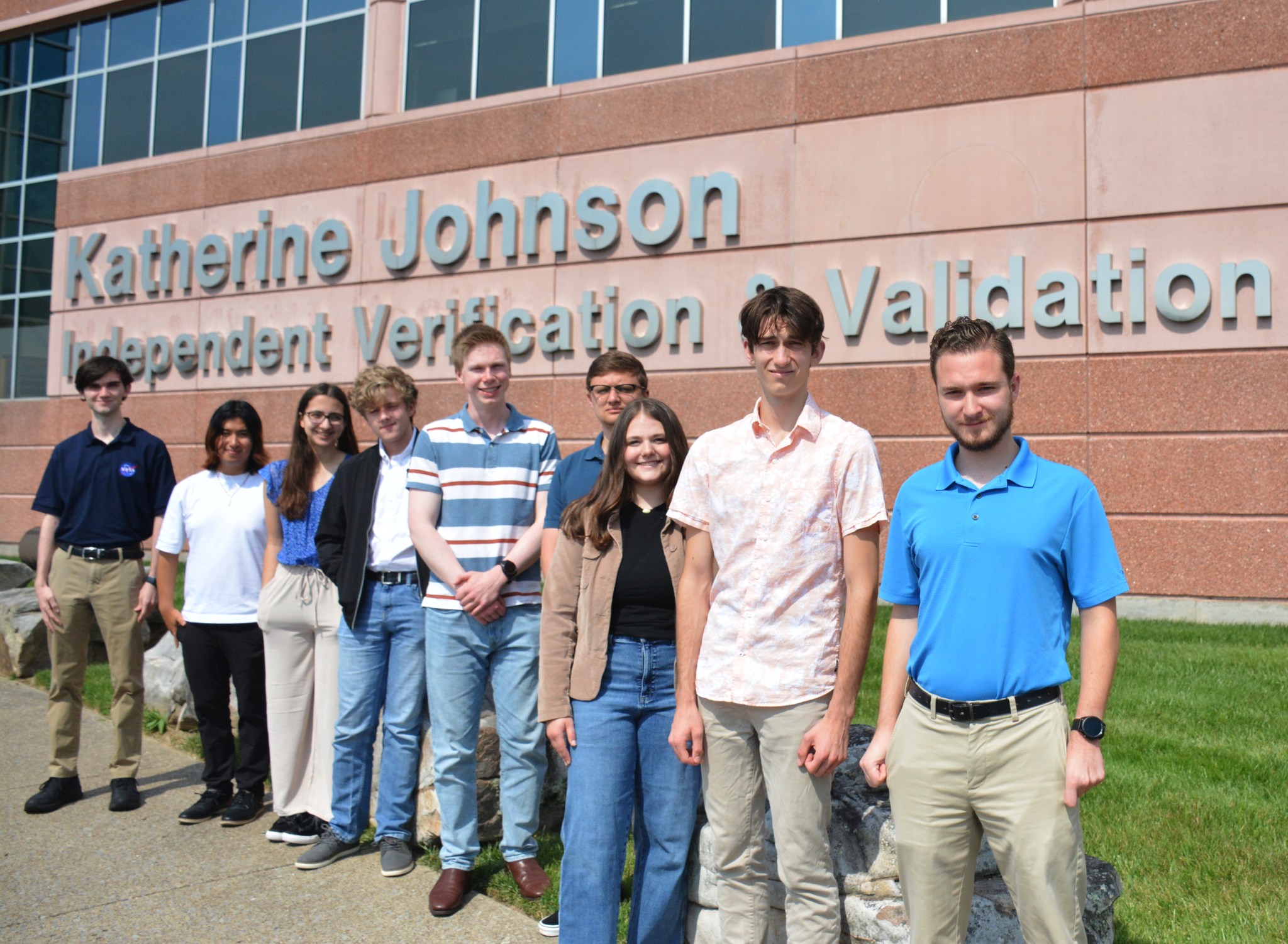 Nine high school and college interns standing in front of the Katherine Johnson IV&V Facility