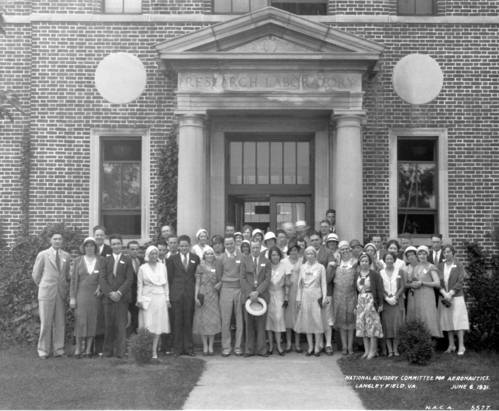 Group photograph in front of building.