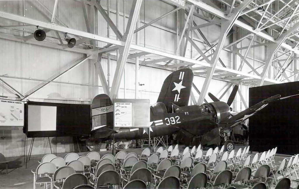 Airplane and empty chairs in hangar.