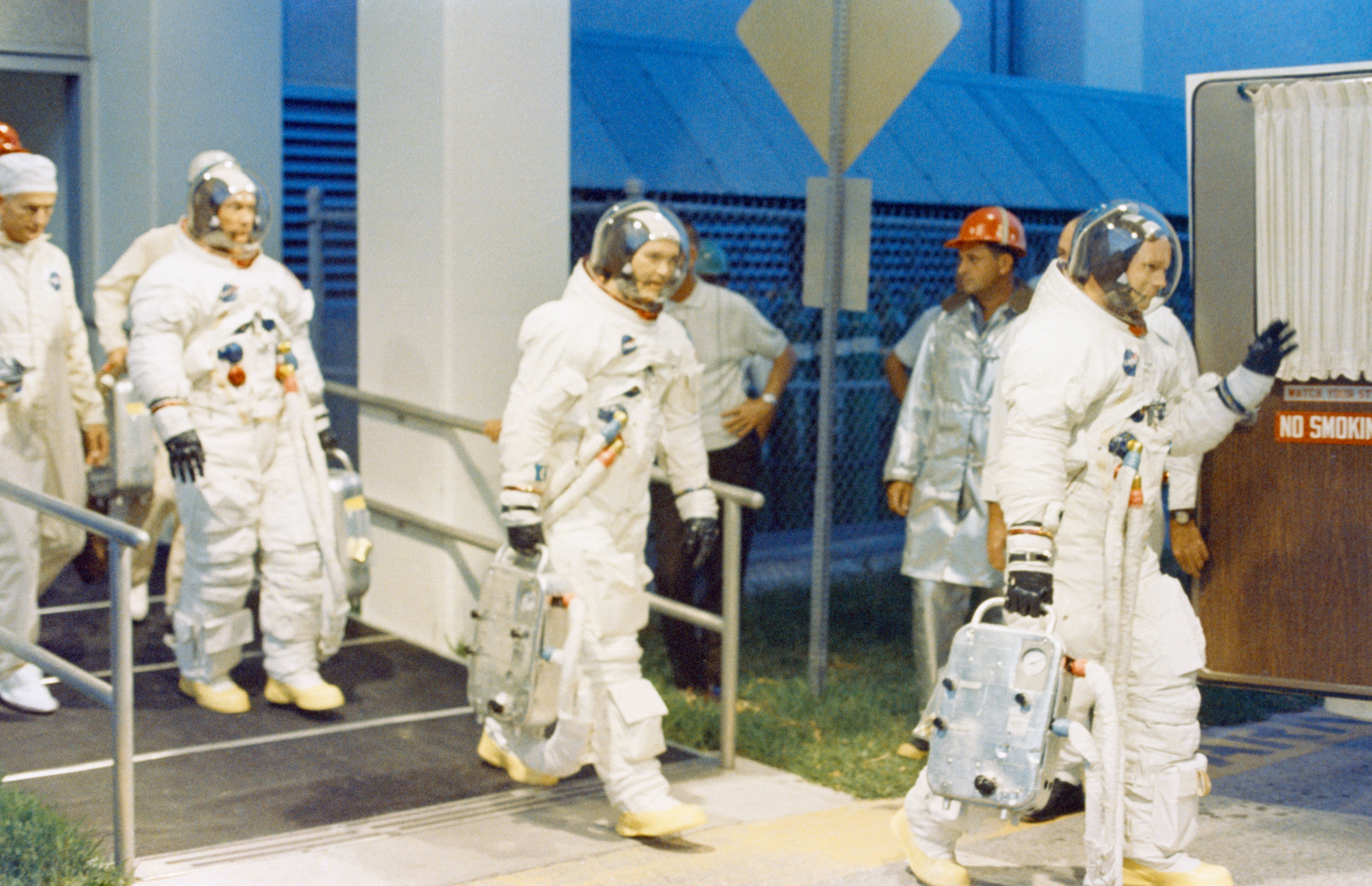 Apollo 11 astronauts Neil A. Armstrong, front, Michael Collins, and Edwin E. “Buzz” Aldrin about to board the transfer van to Launch Pad 39A for the Countdown Demonstration Test (CDDT)