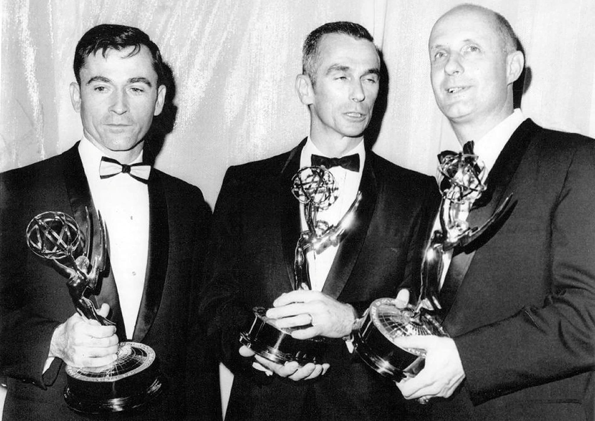 Apollo 10 astronauts John W. Young, left, Eugene A. Cernan, and Thomas P. Stafford hold their Emmy Awards