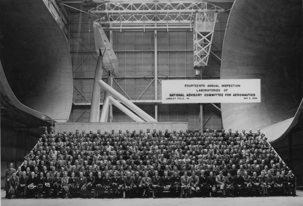 Large group seated in wind tunnel.