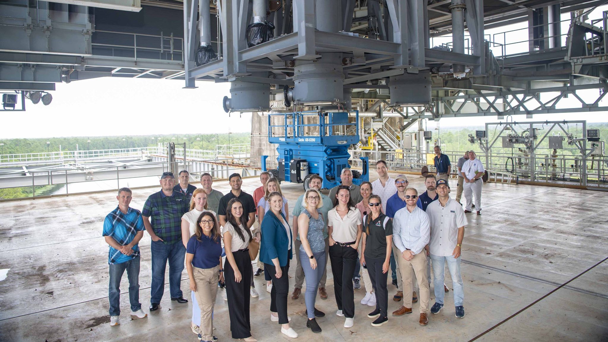 Congressional staff delegates representing eight states along with NASA and U.S. Air Force representatives pose for a photo while visiting the Thad Cochran Test Stand