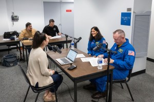 Courtney Beasley is pictured with NASA astronauts Butch Wilmore and Suni Williams while recording Houston We Have a Podcast, Episode 332: Crew Flight Test: The Astronauts. Credit: NASA