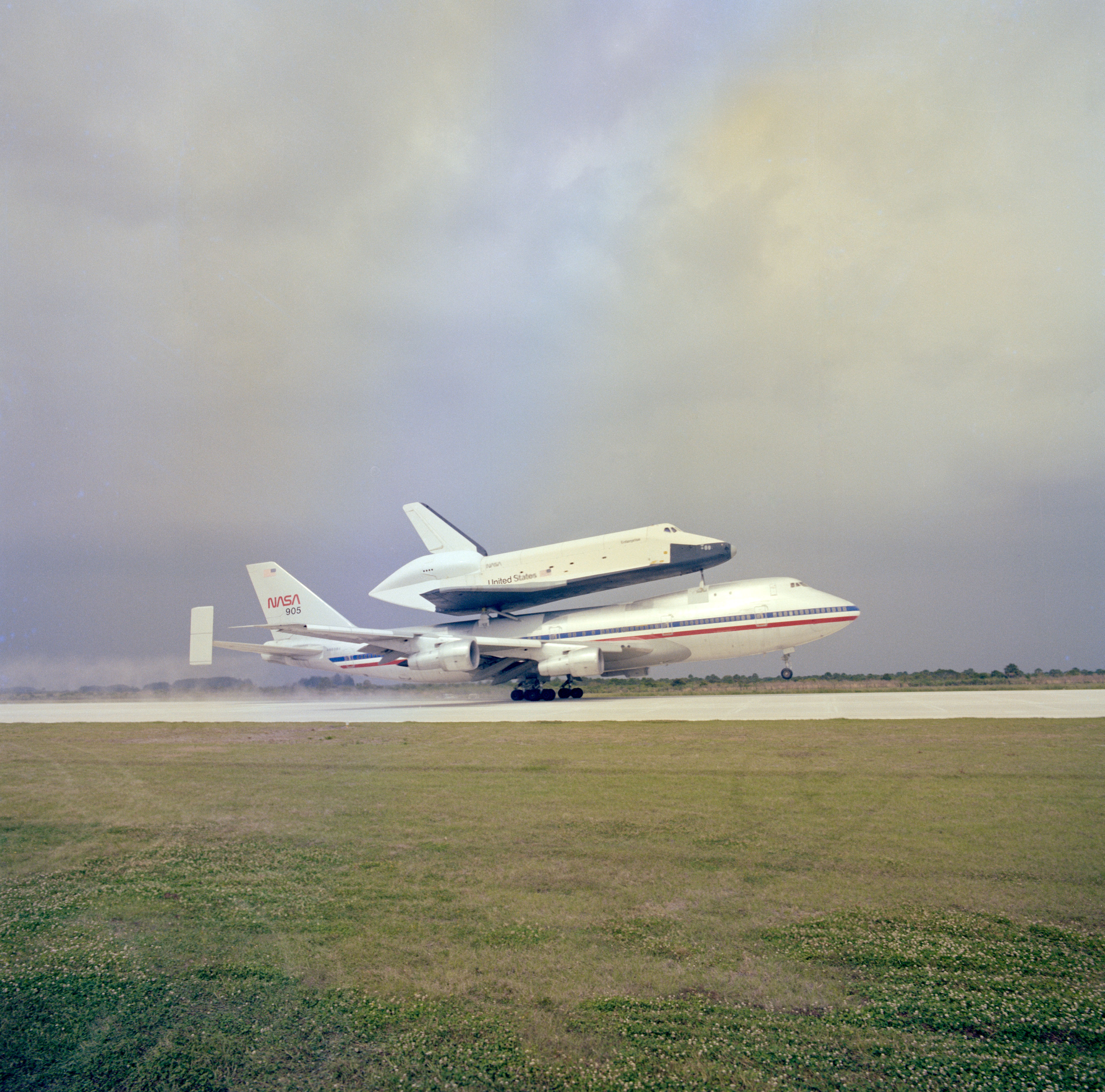 Enterprise atop its Shuttle Carrier Aircraft (SCA) touches down on the runway at NASA's Kennedy Space Center in Florida