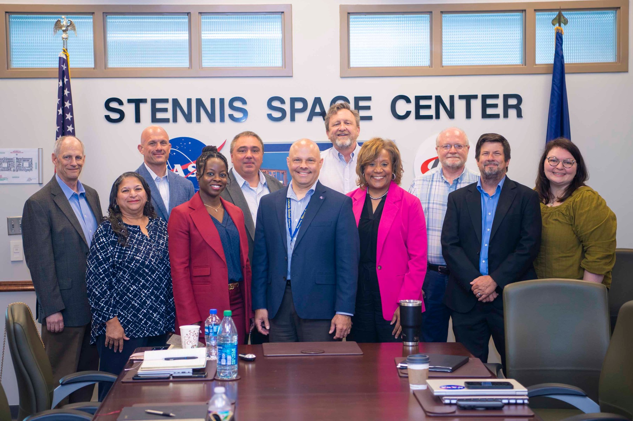 Members of NASA’s Mission Support Directorate stand for a photo with leaders from NASA’s Stennis Space Center and the NASA Shared Services Center