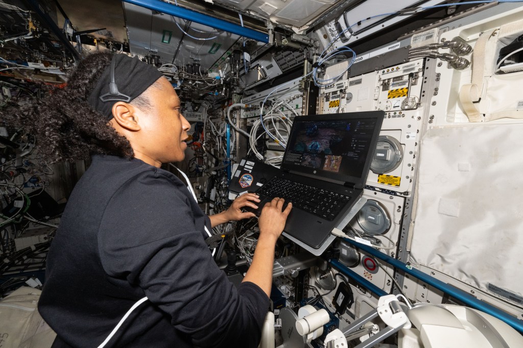 NASA astronaut and Expedition 71 Flight Engineer Jeanette Epps is pictured inside the International Space Station's Columbus laboratory module. She was exploring ways to control a robot on the ground from a spacecraft. Epps coordinated with robotics engineers on Earth remotely manipulating a robot using a computer while testing its ergonomic features and haptic feedback for conditions such as wind and gravity. Results may inform future exploration missions to the Moon, Mars, and beyond.