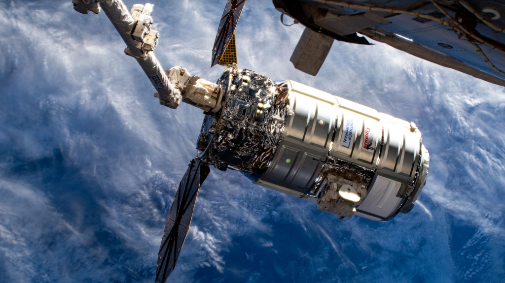 Northrop Grumman's Cygnus space freighter is attached to the leading end effector of the 57.7-foot-long Canadarm2 robotic arm about to be released into Earth orbit ending a five-and-a-half month cargo mission berthed to the International Space Station's Unity module.