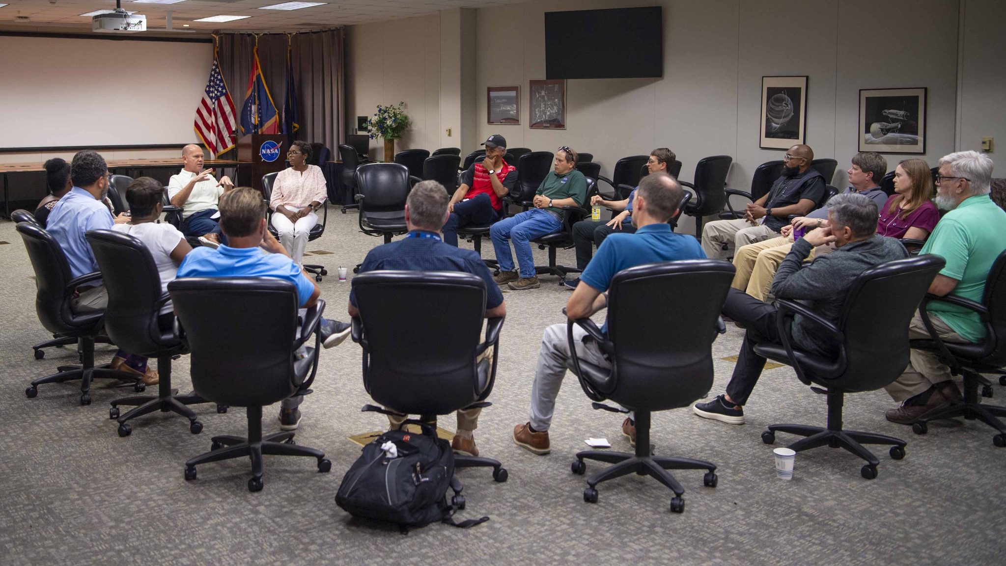 NASA Stennis Director John Bailey sits with NASA Stennis supervisors