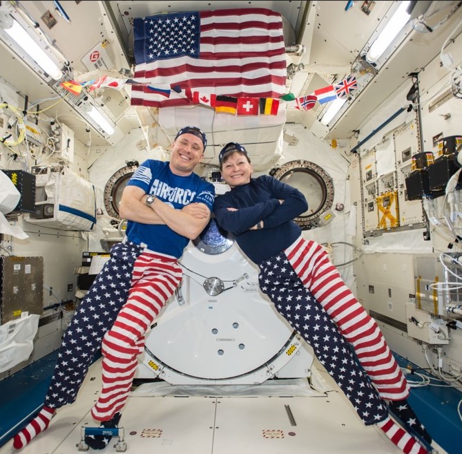 July 4, 2017. During Expedition 52, NASA astronauts Jack D. Fischer and Peggy A. Whitson show off their patriotic outfits.