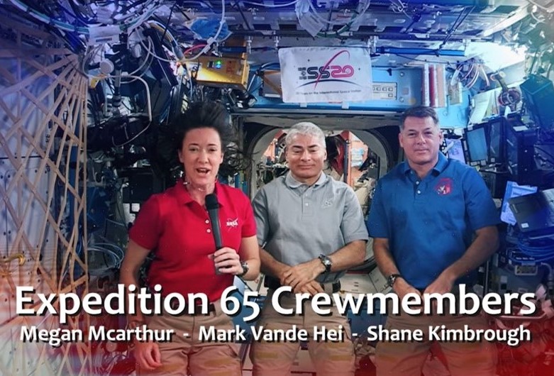 July 4, 2021. The Expedition 65 crew, K. Megan McArthur, left, Mark T. Vande Hei, and R. Shane Kimbrough, tapes a Fourth of July message