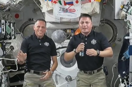 Expedition 67 NASA astronauts Robert T. Hines, left, and Kjell N. Lindgren during their recorded Fourth of July message