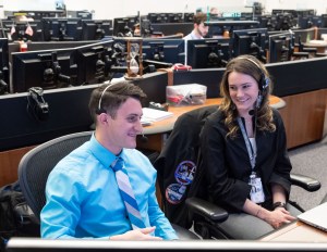 Leah Cheshier and Gary Jordan are pictured on console at the Mission Control Center in Houston during a live mission event. Credit: NASA