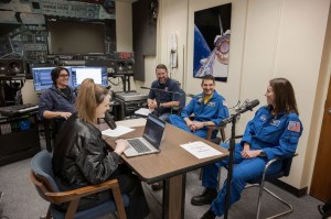 Leah Cheshier is pictured with NASA astronauts Jack Hathaway and Chris Birch during the recording of Houston We Have a Podcast, Episode 325: Astronaut Graduation 2024. Credit: NASA