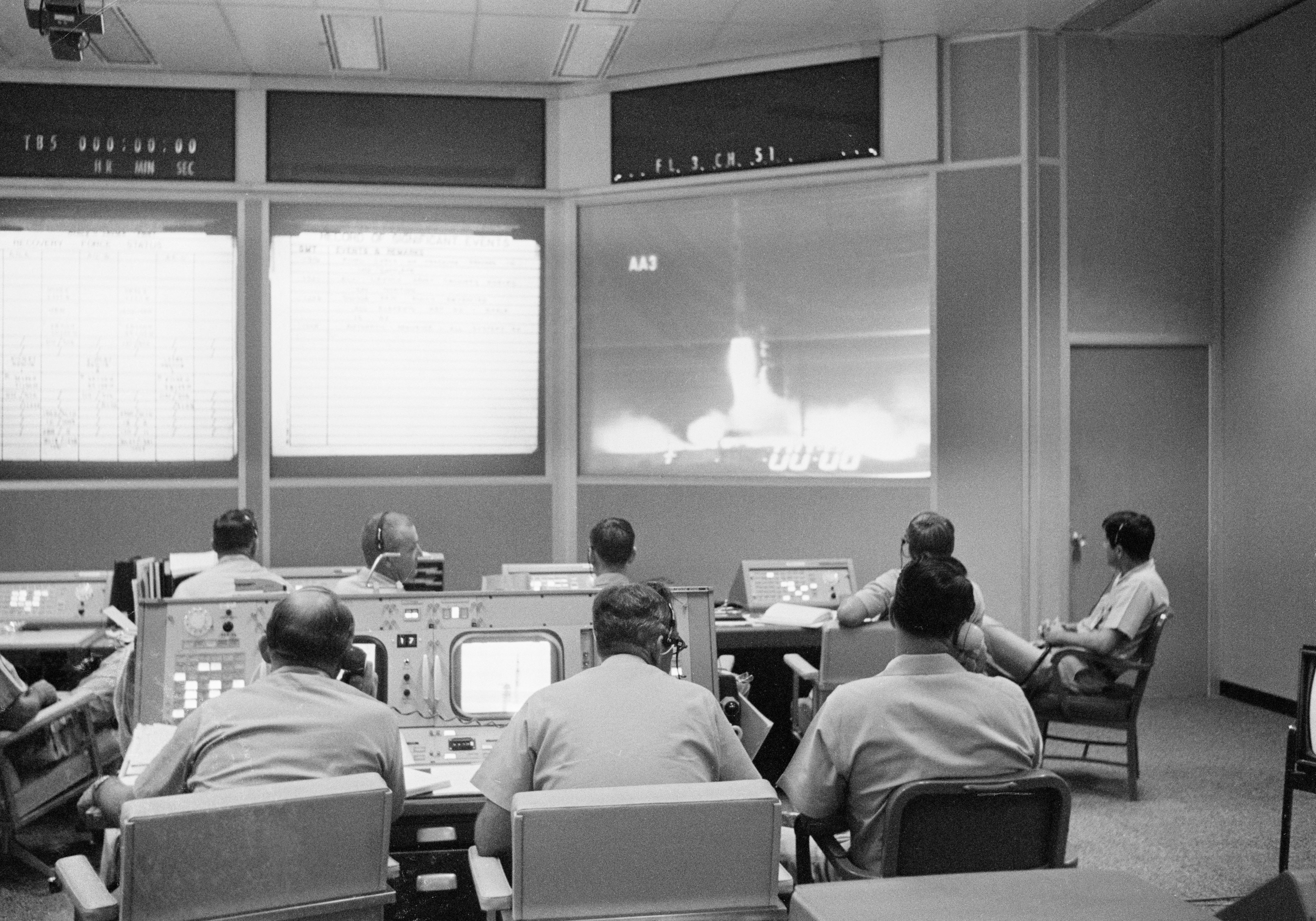 Engineers in the Mission Control Center at the Manned Spacecraft Center, now NASA's Johnson Space Center in Houston, take over control of the flight once the tower is clear