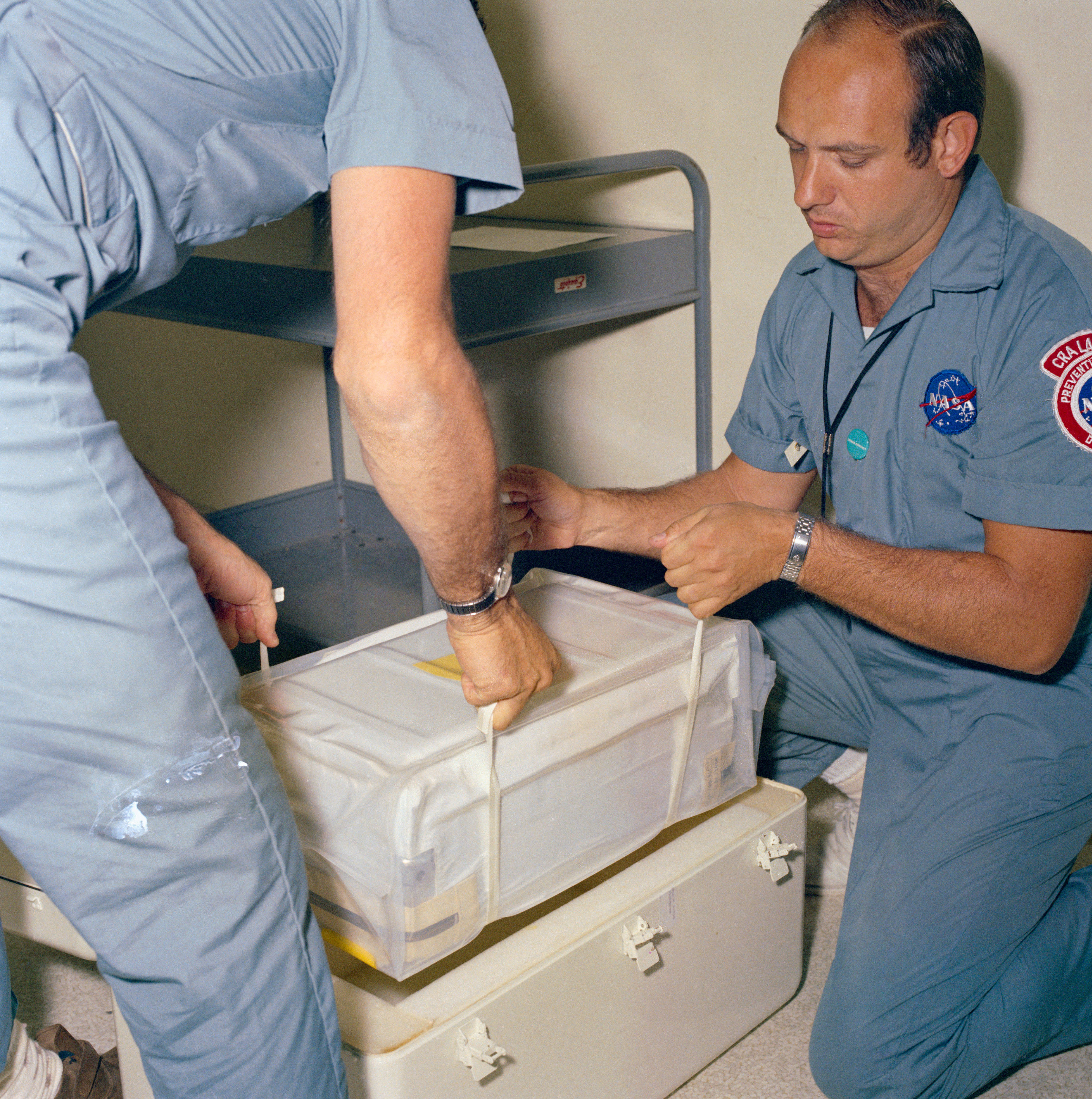 In the LRL, technicians at MSC unpack the first box of Moon rocks