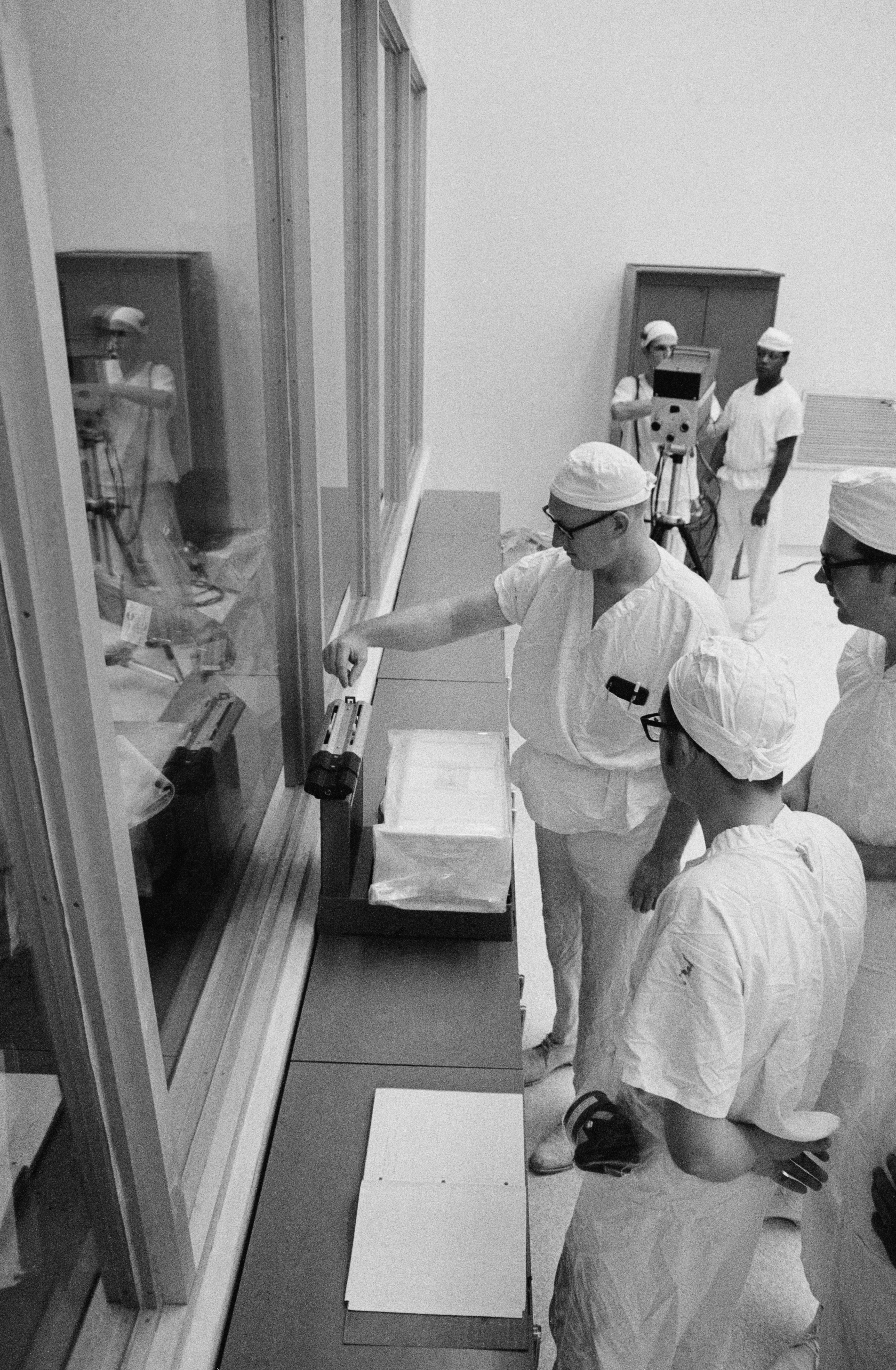 Technicians weigh the box of Moon rocks