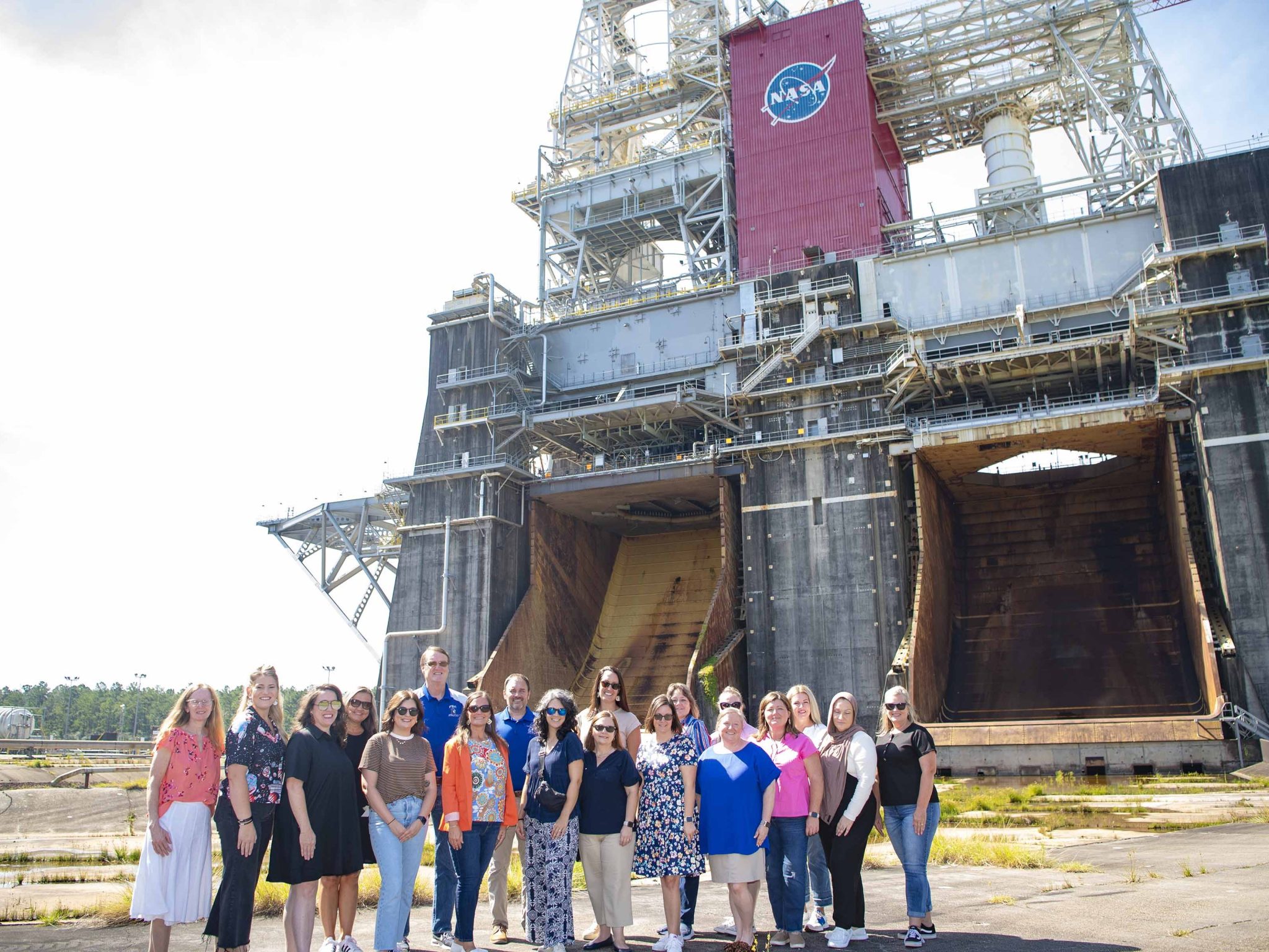 Pearl River County Elementary School leaders visit the Thad Cochran Test Stand (B-1/B-2) and pose for a photo in front of it.