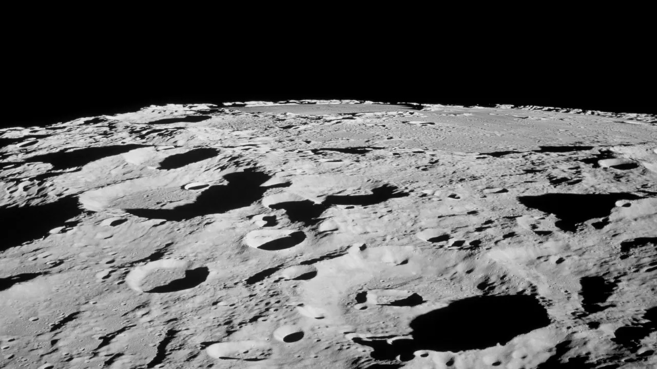 From lunar orbit, astronauts pointed cameras out the window of their spacecraft to capture photos of the moon's surface.