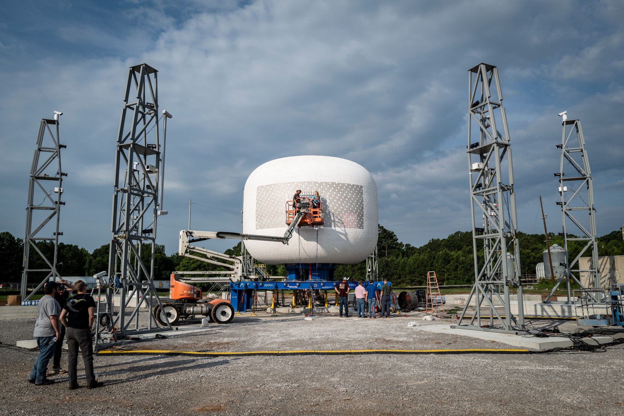 A photograph showing Sierra Space’s LIFE habitat on the test stand at NASA’s Marshall Space Flight Center ahead of a burst test. The LIFE habitat will be part of Blue Origin's commercial destination, Orbital Reef.