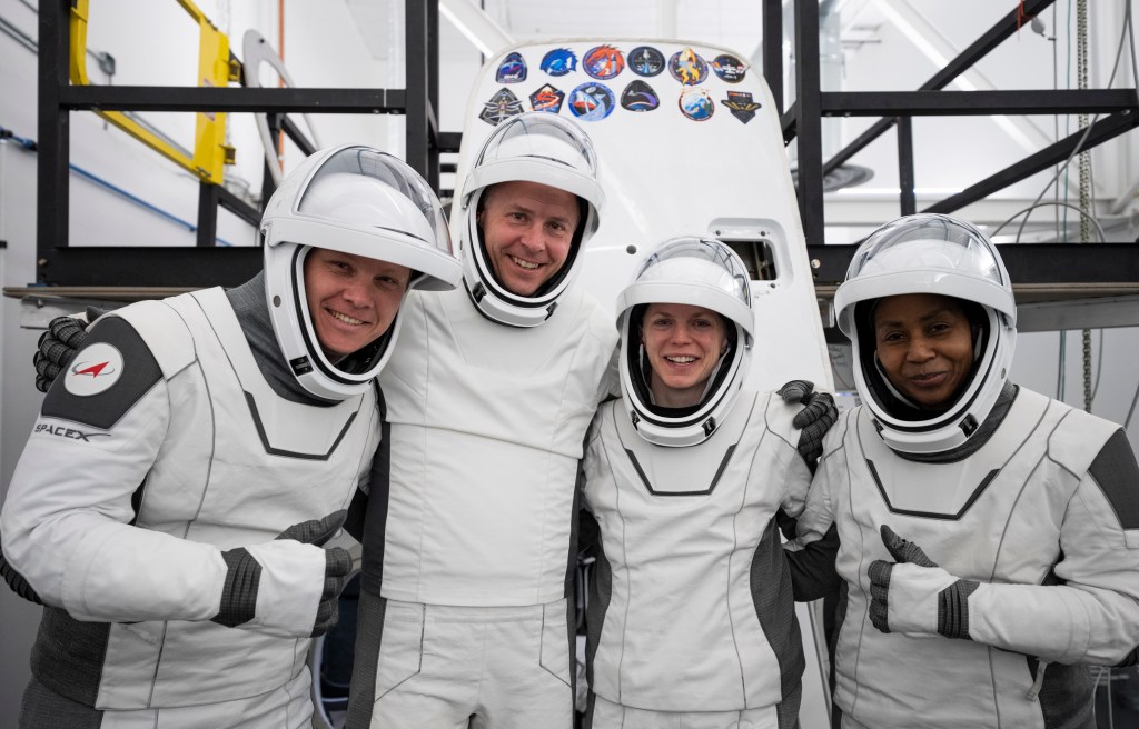 Members of NASA's SpaceX Crew-9 crew pose for a photo at SpaceX's headquarters in Hawthorne, California.