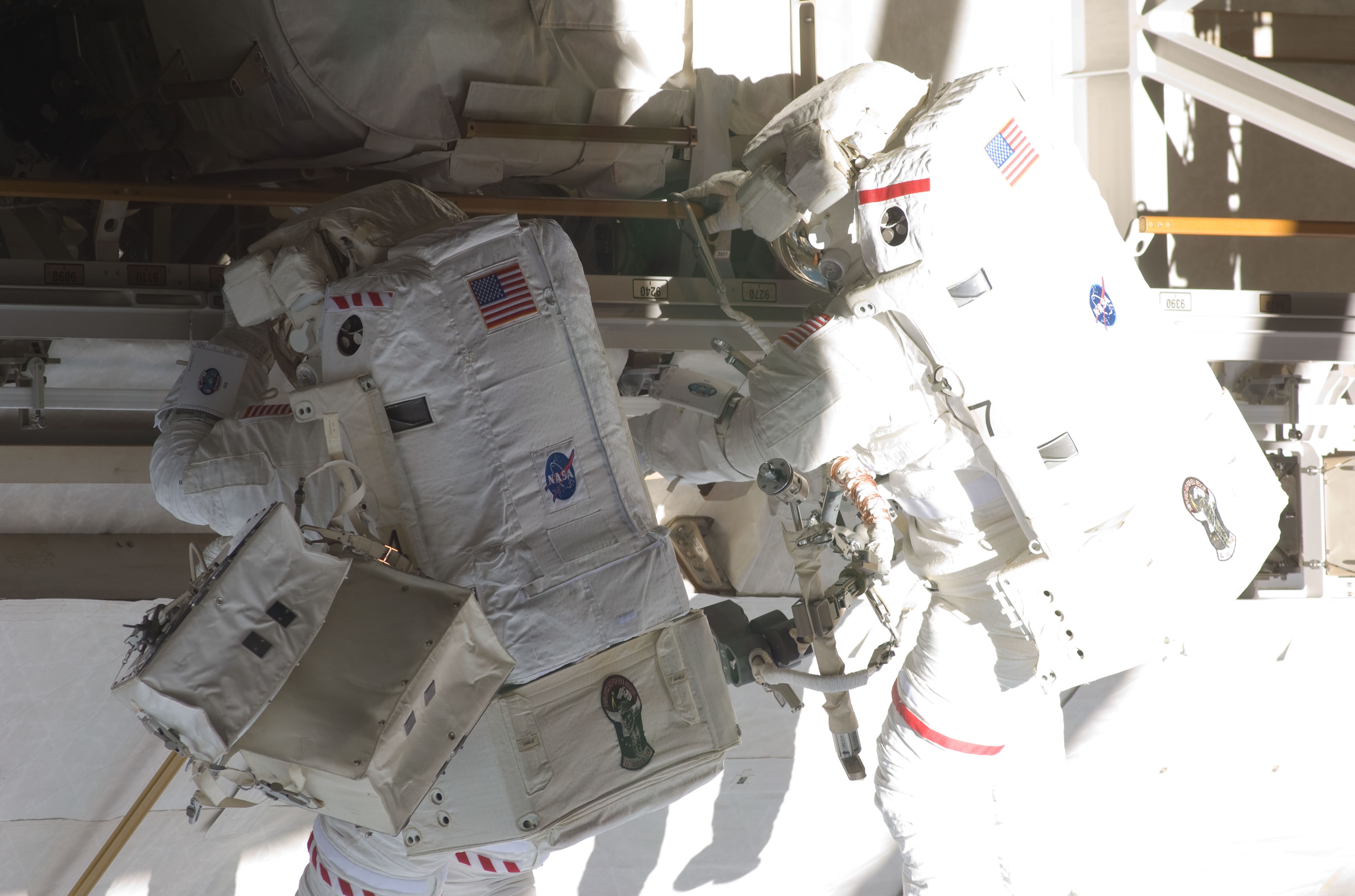 Christopher J. Cassidy, left, and David A. Wolf during the mission’s third spacewalk