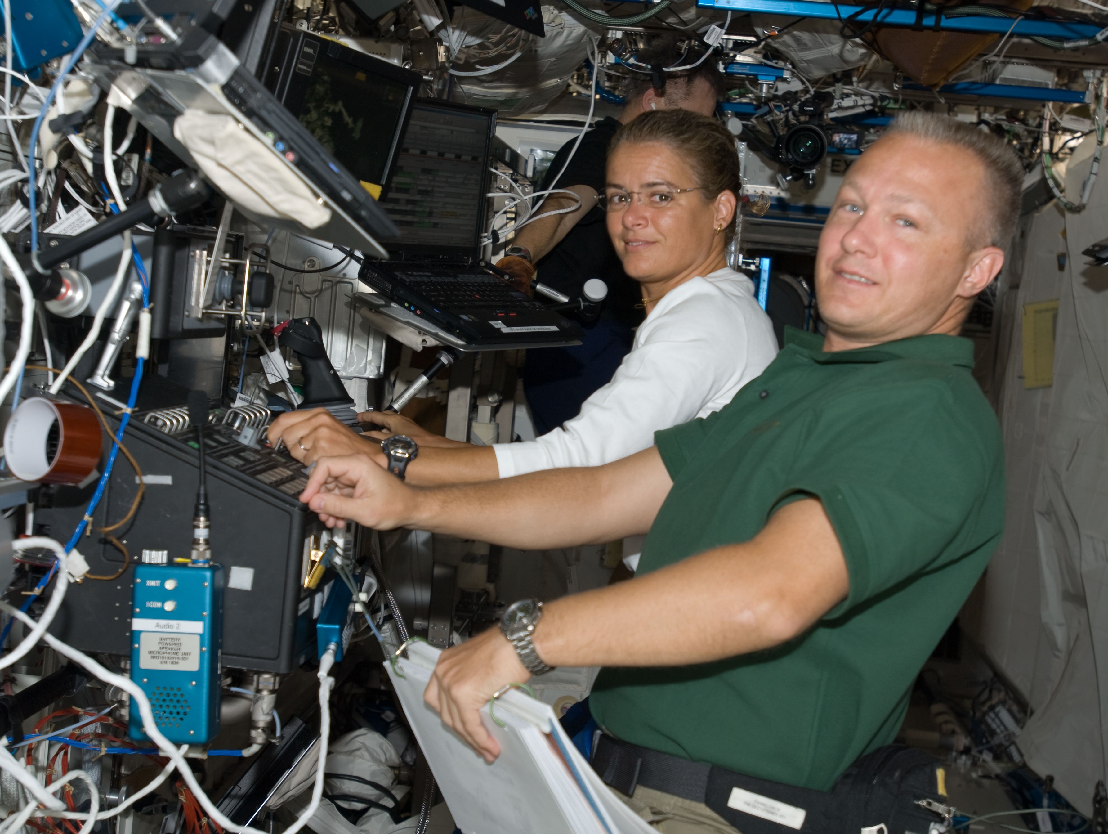 Canadian Space Agency astronaut Julie Payette, left, and NASA astronaut Douglas G. Hurley operate the station’s robotic arm during the fourth spacewalk