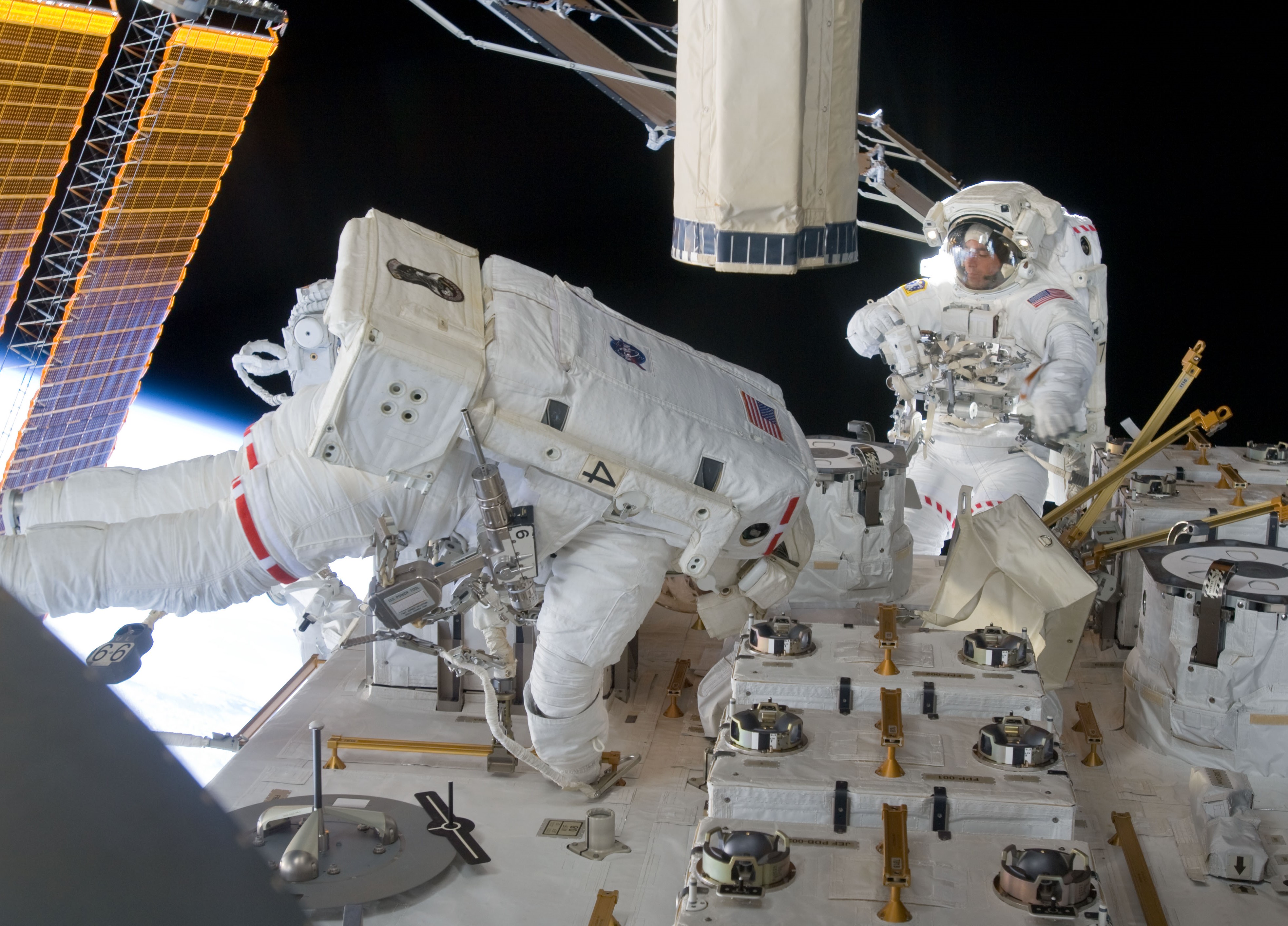 Marshburn, left, and Cassidy install cameras on the Kibo Exposed Facility during the fifth and final spacewalk