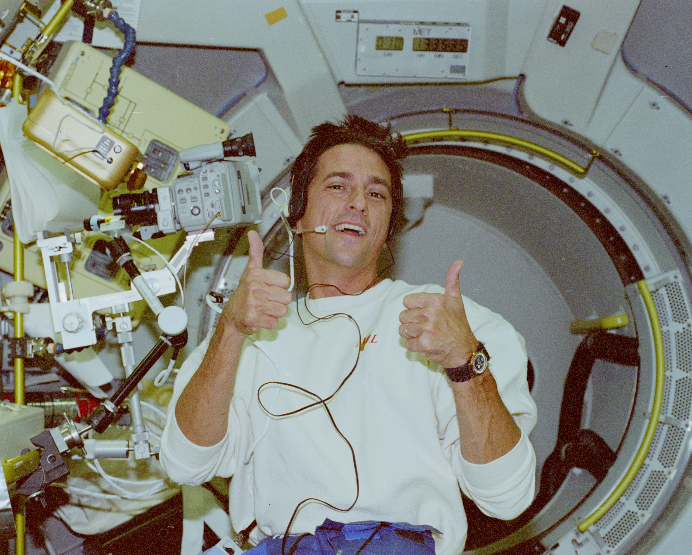 Donald A. Thomas gives two thumbs up for the crew’s performance during the mission