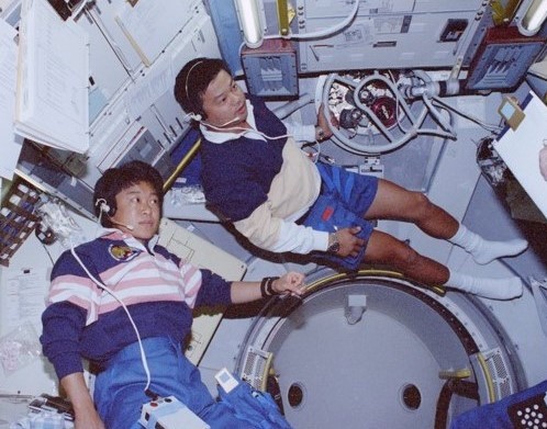 The first time two Asians fly on the shuttle at the same time - Chiaki Mukai, left, of the National Space Development Agency of Japan, now the Japan Aerospace Exploration Agency, left, and NASA astronaut Leroy Chiao