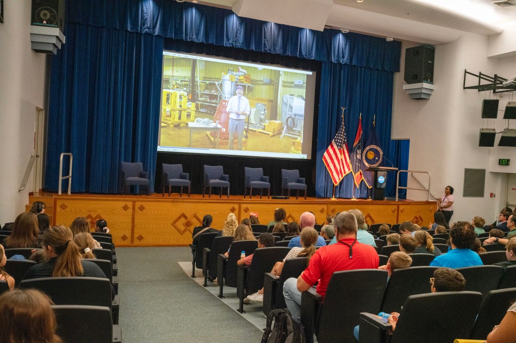 Participants in the annual Take Our Children to Work Day watch video message from NASA Stennis Associate Director Rodney McKellip