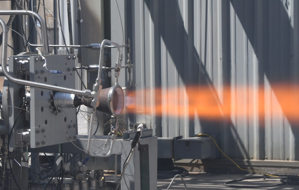 Shown above, during a hot-fire test at NASA's Marshall Space Flight Center in Huntsville, Alabama, this 2,000-pound-force coupled thrust chamber assembly features a NASA HR-1 alloy nozzle. Manufacturing the hardware requires the directed energy deposition process with composite-overwrap for structural support, reducing weight by 40%. Industry, academic, and government partners are working with RAMPT engineers at Marshall and other NASA field centers to advance this revolutionary technology.