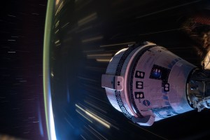 Boeing's Starliner spacecraft that launched NASA's Crew Flight Test astronauts Butch Wilmore and Suni Williams to the International Space Station is pictured docked to the Harmony module's forward port. This long-duration photograph was taken at night from the orbital complex as it soared 258 miles above western China.