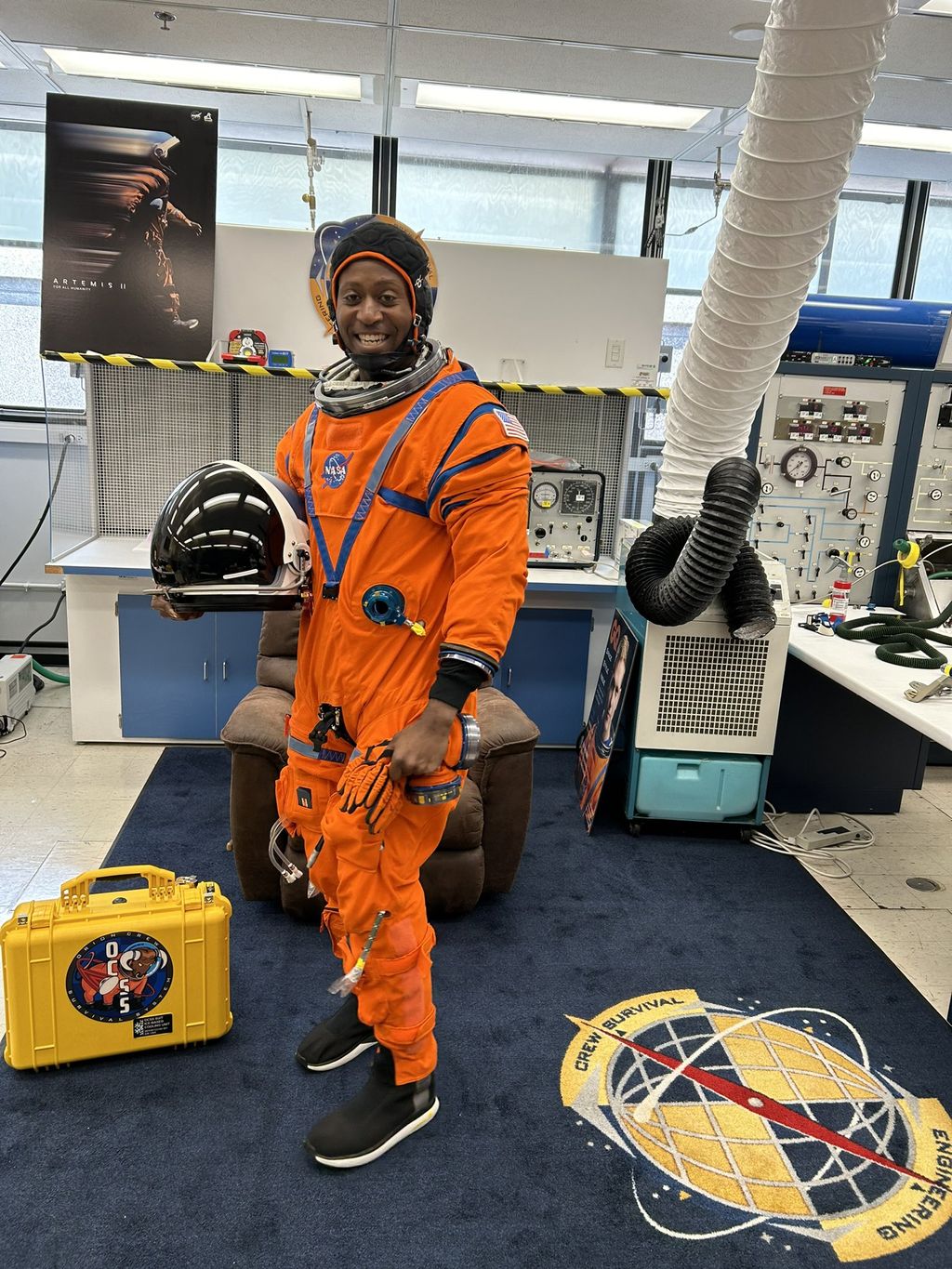 NASA Space Technology Andre Douglas tries on his lunar spacesuit in July 2024