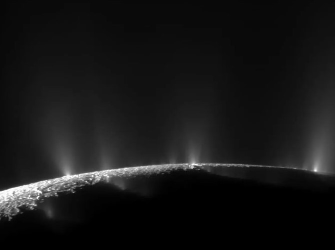 Limb view of Enceladus showing plumes of material emanating from its surface