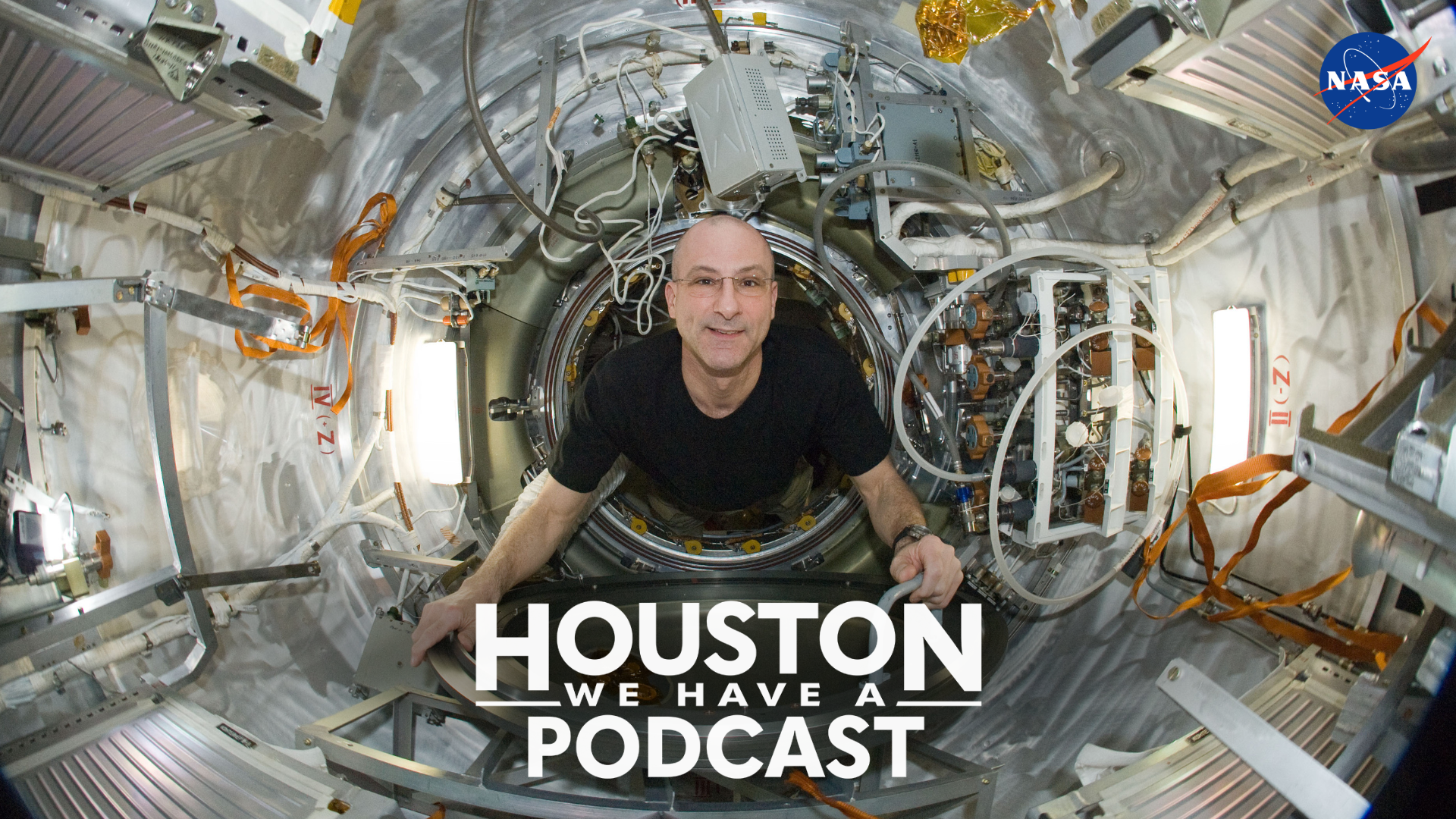 NASA astronaut Don Pettit is pictured floating aboard the International Space Station. Text on the image reads "Houston We Have a Podcast' near the bottom center of the image.