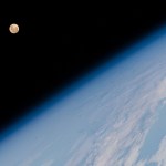 The Full Moon pictured above Earth's horizon as the International Space Station soared 262 miles above the Indian Ocean south of the African island nation of Madagascar.