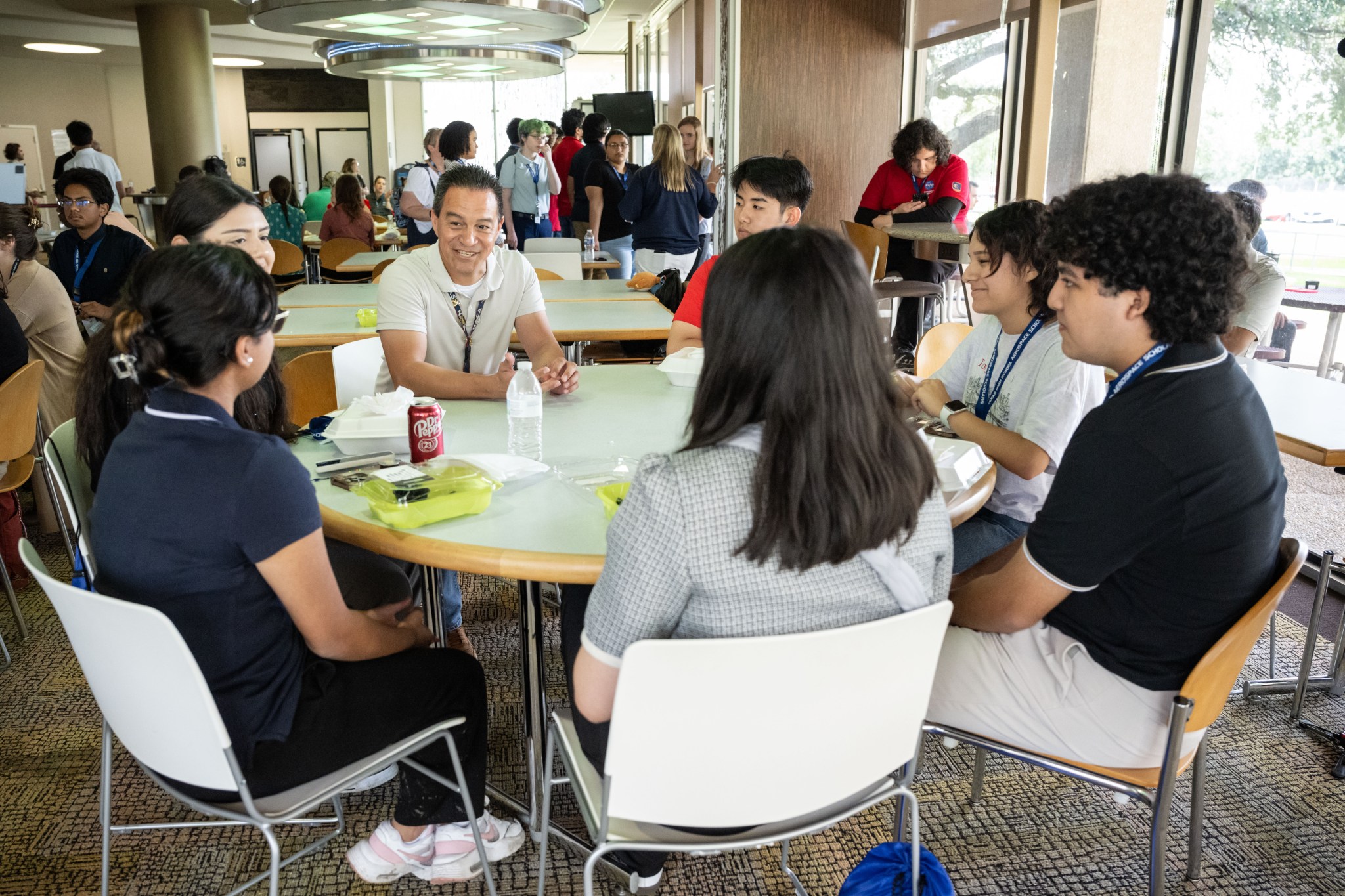 High school students meet and network with NASA employees in a Johnson Space Center cafeteria.