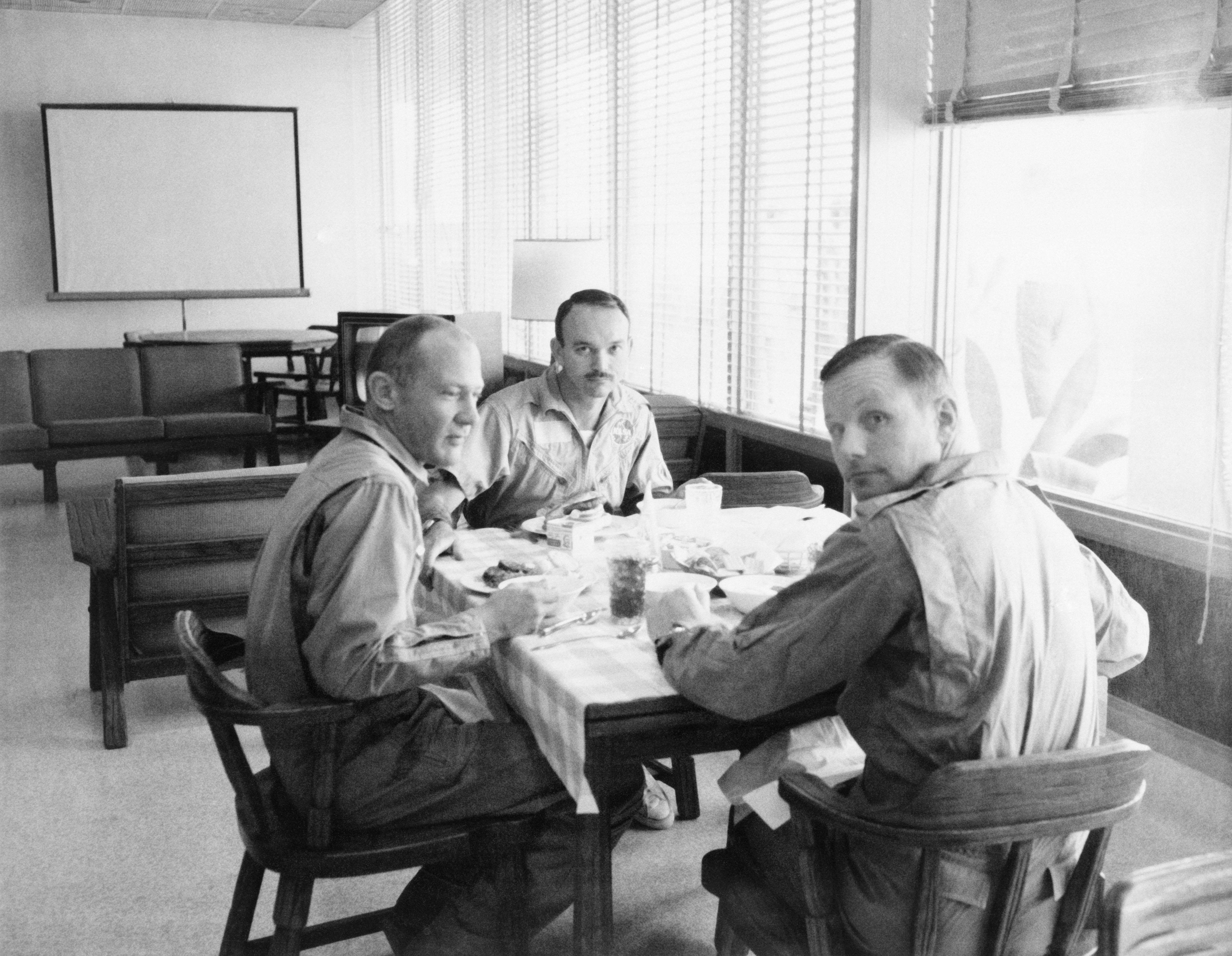 Buzz, left, Mike, and Neil enjoy a meal together in the LRL’s dining room