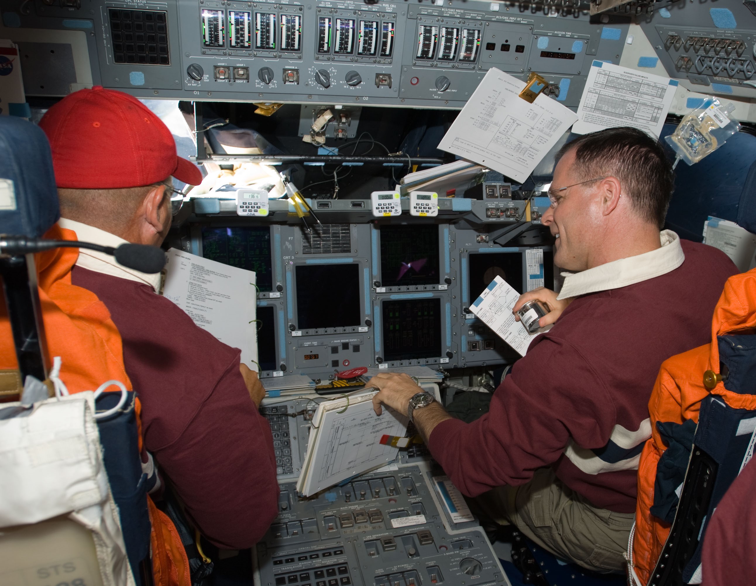 Frederick “Rick” W. Sturckow, left, and Kevin A. Ford perform maneuvers for the rendezvous with the space station