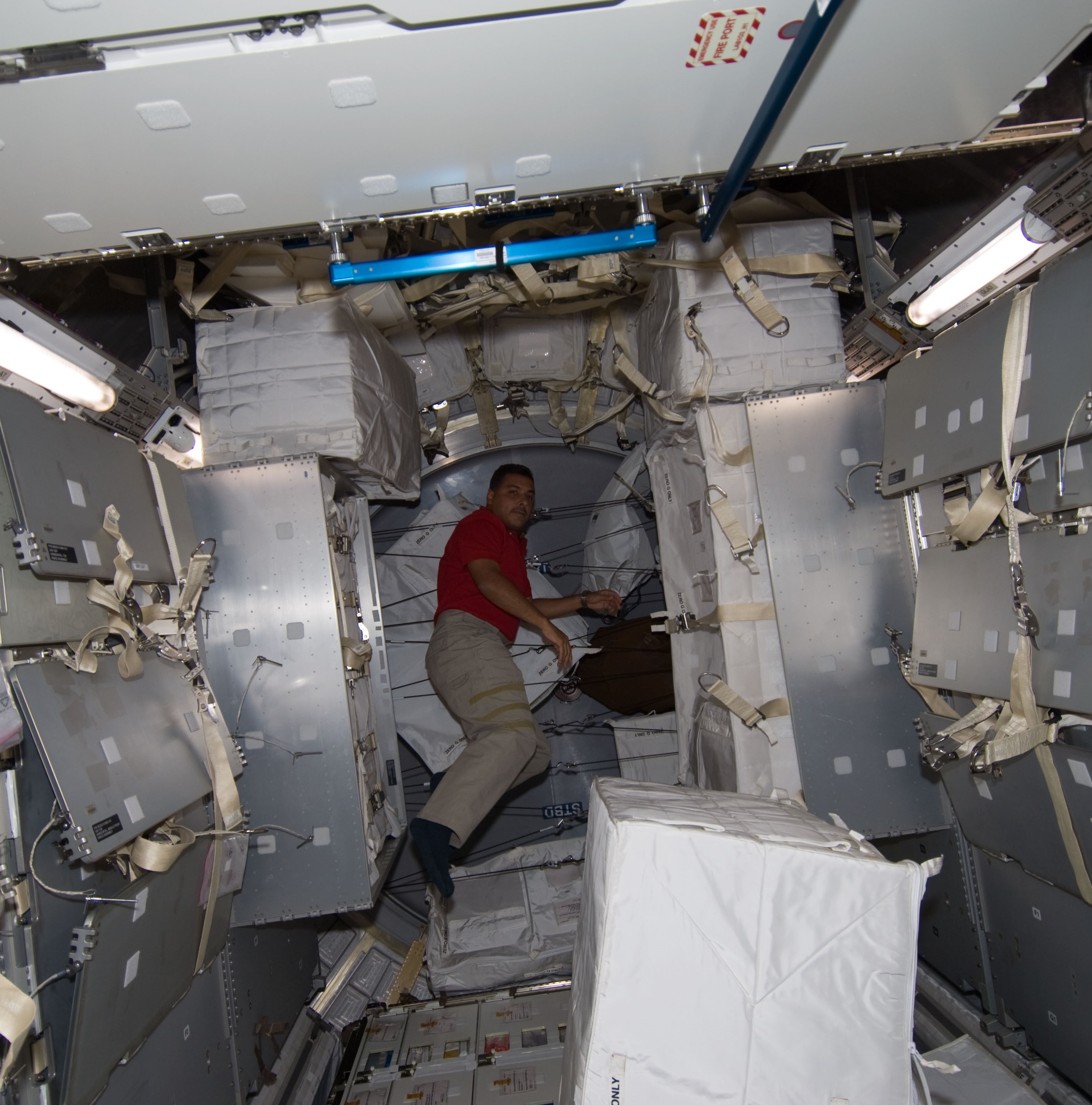 José M. Hernández inside the MPLM to monitor transfer operations